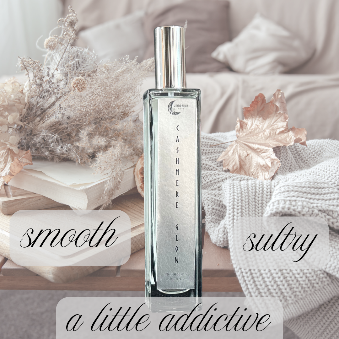 Cashmere Glow Room Spray bottle with warm, decorative background and text reading “Smooth. Sultry. A Little Addictive.