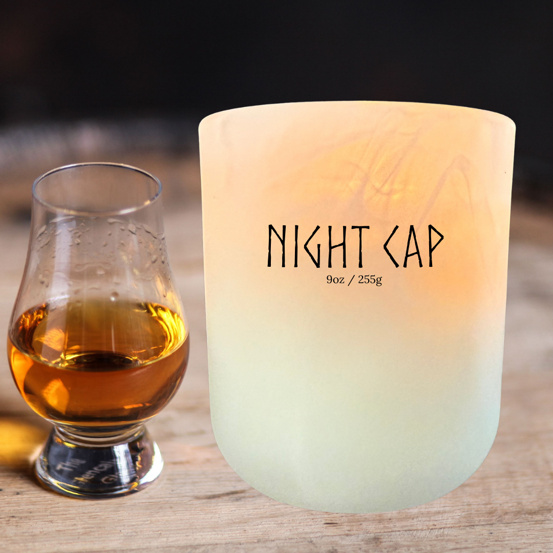 Night Cap soy candle with whiskey glass – warm, sultry handmade candle in cognac, spiced tonka, and musk fragrance.